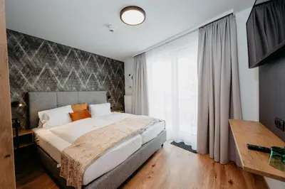 Ein Bett oder Betten in einem Zimmer der Unterkunft Hotel Brückenwirt Superior