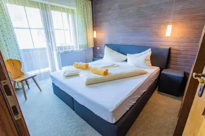 Ein Bett oder Betten in einem Zimmer der Unterkunft Huberhof 5 by Alpenidyll Apartments