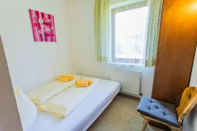 Ein Bett oder Betten in einem Zimmer der Unterkunft Huberhof 5 by Alpenidyll Apartments