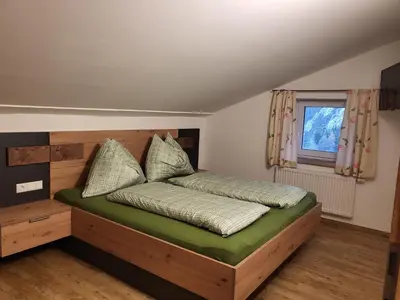 Ein Bett oder Betten in einem Zimmer der Unterkunft Saumerhof