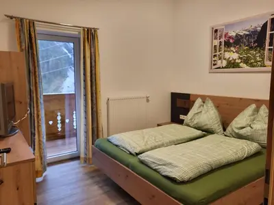 Ein Bett oder Betten in einem Zimmer der Unterkunft Saumerhof