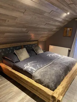 Ein Bett oder Betten in einem Zimmer der Unterkunft Chalet am Weißenbach