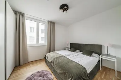 Ein Bett oder Betten in einem Zimmer der Unterkunft Traunseeresidenzen