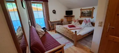 Ein Bett oder Betten in einem Zimmer der Unterkunft BioBauernhof Fresoldhof
