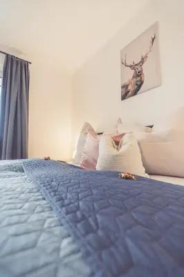 Ein Bett oder Betten in einem Zimmer der Unterkunft Anna Pertl - lieblingsquartier