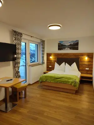 Ein Bett oder Betten in einem Zimmer der Unterkunft Appartement Kuschelzeit Jansenbichl