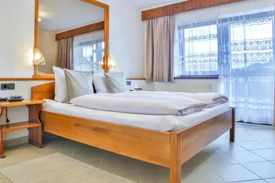 Ein Bett oder Betten in einem Zimmer der Unterkunft Hotel Pension Residence