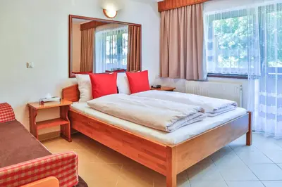 Ein Bett oder Betten in einem Zimmer der Unterkunft Hotel Pension Residence