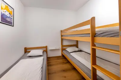 Ein Bett oder Betten in einem Zimmer der Unterkunft Haus Aineckblick Top 2
