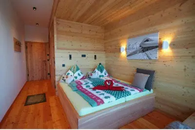 Ein Bett oder Betten in einem Zimmer der Unterkunft Krummholzhütte