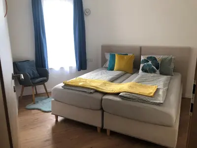 Ein Bett oder Betten in einem Zimmer der Unterkunft Residence JORADO