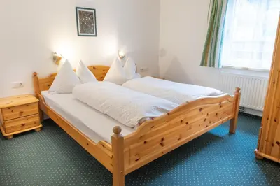 Ein Bett oder Betten in einem Zimmer der Unterkunft Appartmenthaus Bachler