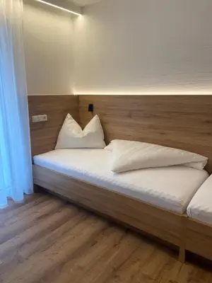 Ein Bett oder Betten in einem Zimmer der Unterkunft Ski & Bike Appartements