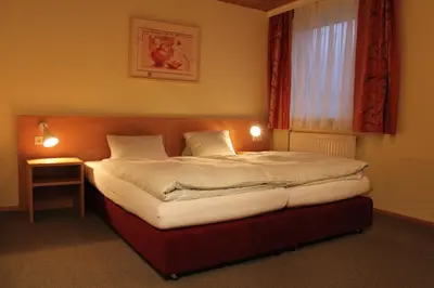 Ein Bett oder Betten in einem Zimmer der Unterkunft Hotel Denk Bed & Breakfast