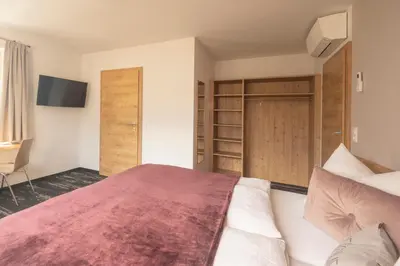 Ein Bett oder Betten in einem Zimmer der Unterkunft good-goisern hotel
