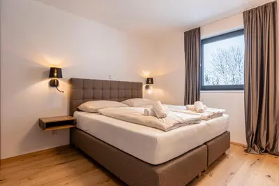 Ein Bett oder Betten in einem Zimmer der Unterkunft Hideaway Dachstein West by ALPS RESORTS
