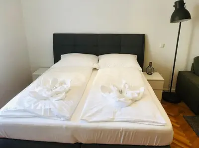Ein Bett oder Betten in einem Zimmer der Unterkunft Fewo Kuferzeile Gmunden seenähe