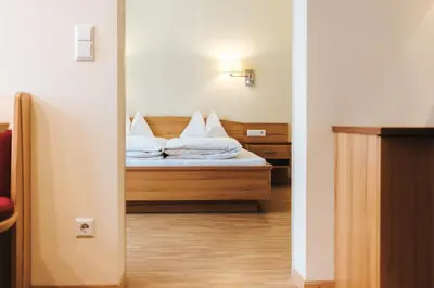 Ein Bett oder Betten in einem Zimmer der Unterkunft Hotel Schneider Dependance