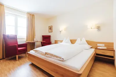 Ein Bett oder Betten in einem Zimmer der Unterkunft Hotel Schneider Dependance