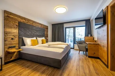 Ein Bett oder Betten in einem Zimmer der Unterkunft Aparthotel Fuxbau