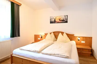 Ein Bett oder Betten in einem Zimmer der Unterkunft Ferienappartement Royer