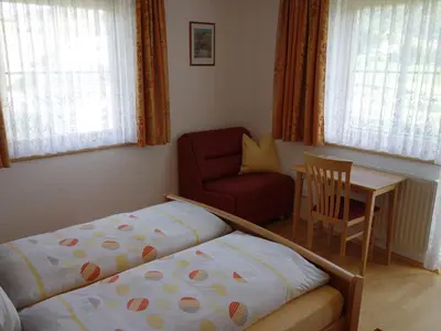 Ein Bett oder Betten in einem Zimmer der Unterkunft Haus Bauer Appartment II mit Balkon
