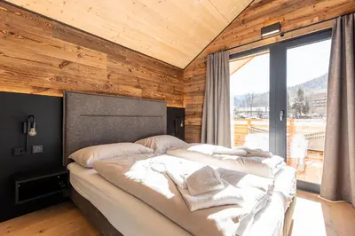 Ein Bett oder Betten in einem Zimmer der Unterkunft Kreischberg Pool Villas & Penthouses by ALPS RESORTS