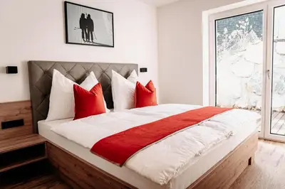 Ein Bett oder Betten in einem Zimmer der Unterkunft Tanners Chalet Apartments