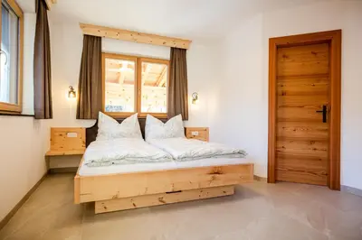 Ein Bett oder Betten in einem Zimmer der Unterkunft Bauernhaus Chalet Unterkoller