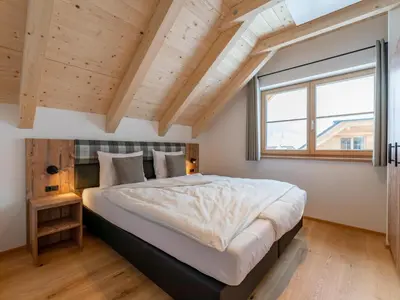 Ein Bett oder Betten in einem Zimmer der Unterkunft Haus Enzian