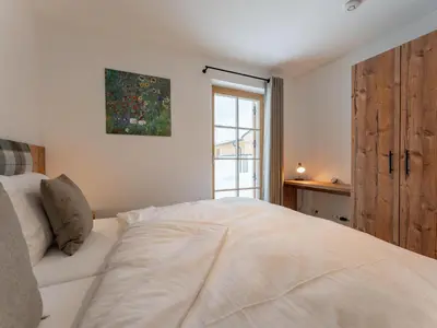 Ein Bett oder Betten in einem Zimmer der Unterkunft Haus Enzian
