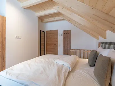 Ein Bett oder Betten in einem Zimmer der Unterkunft Haus Enzian