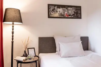Ein Bett oder Betten in einem Zimmer der Unterkunft Der Thomataler Wirt