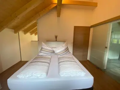Ein Bett oder Betten in einem Zimmer der Unterkunft 'dasBergblick'