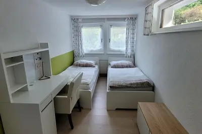 Ein Bett oder Betten in einem Zimmer der Unterkunft Wohnung mit Garten, Sauna und Infrarotkabine
