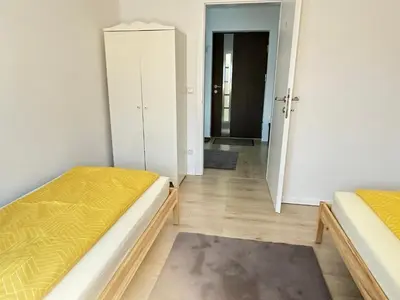Ein Bett oder Betten in einem Zimmer der Unterkunft Appartement Niederthalheim
