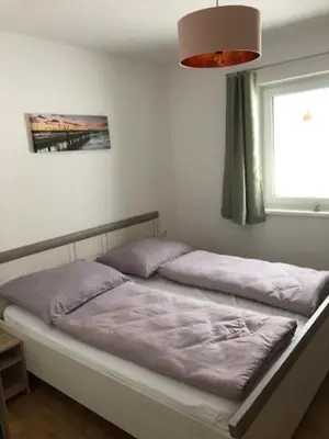 Ein Bett oder Betten in einem Zimmer der Unterkunft Ferienwohnung Jenny
