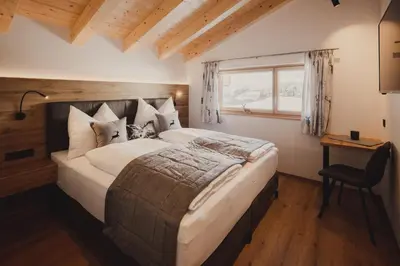 Ein Bett oder Betten in einem Zimmer der Unterkunft Chalet Hochthron