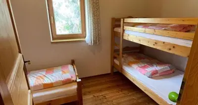 Ein Bett oder Betten in einem Zimmer der Unterkunft Ferienhaus 1