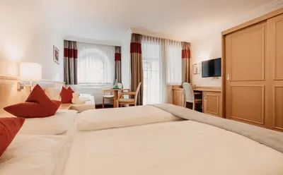 Ein Bett oder Betten in einem Zimmer der Unterkunft Heart Hotel Himmelberg