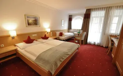 Ein Bett oder Betten in einem Zimmer der Unterkunft Heart Hotel Himmelberg