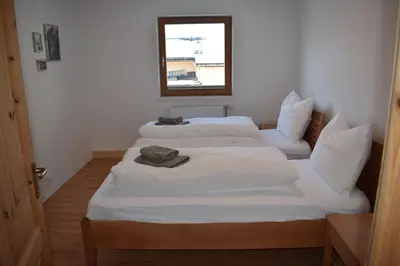 Ein Bett oder Betten in einem Zimmer der Unterkunft Apartments Sprung