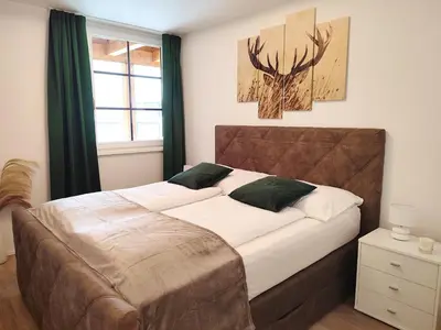 Ein Bett oder Betten in einem Zimmer der Unterkunft Modern Mountain Apartment - free parking & sauna