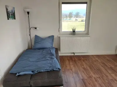 Ein Bett oder Betten in einem Zimmer der Unterkunft Ferienwohnung ländlich und in Seenähe