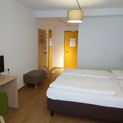 Ein Bett oder Betten in einem Zimmer der Unterkunft Gesundheit & Wellness Resort Bad Mitterndorf