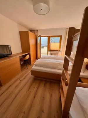 Ein Bett oder Betten in einem Zimmer der Unterkunft Sonnhang Apartment Unterkofler