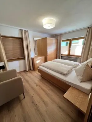 Ein Bett oder Betten in einem Zimmer der Unterkunft Sonnhang Apartment Unterkofler