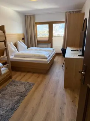 Ein Bett oder Betten in einem Zimmer der Unterkunft Sonnhang Apartment Unterkofler