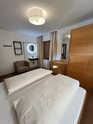 Ein Bett oder Betten in einem Zimmer der Unterkunft Sonnhang Apartment Unterkofler