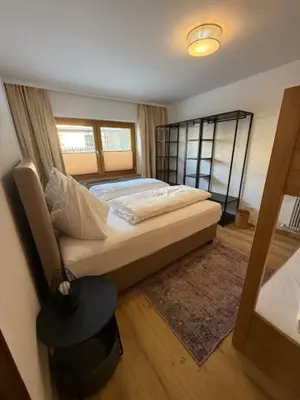 Ein Bett oder Betten in einem Zimmer der Unterkunft Sonnhang Apartment Unterkofler